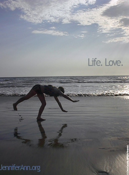Picture of Jennifer Ann Crecente at the age of 14 performing a cartwheel in the surf in Mazatlan, Mexico.